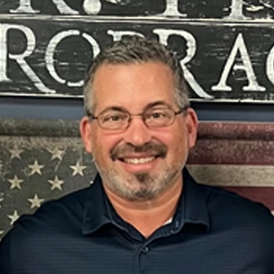 A headshot photo of Dr. Corey Piva, the chiropractor at Pleasant Hill Chiropractic